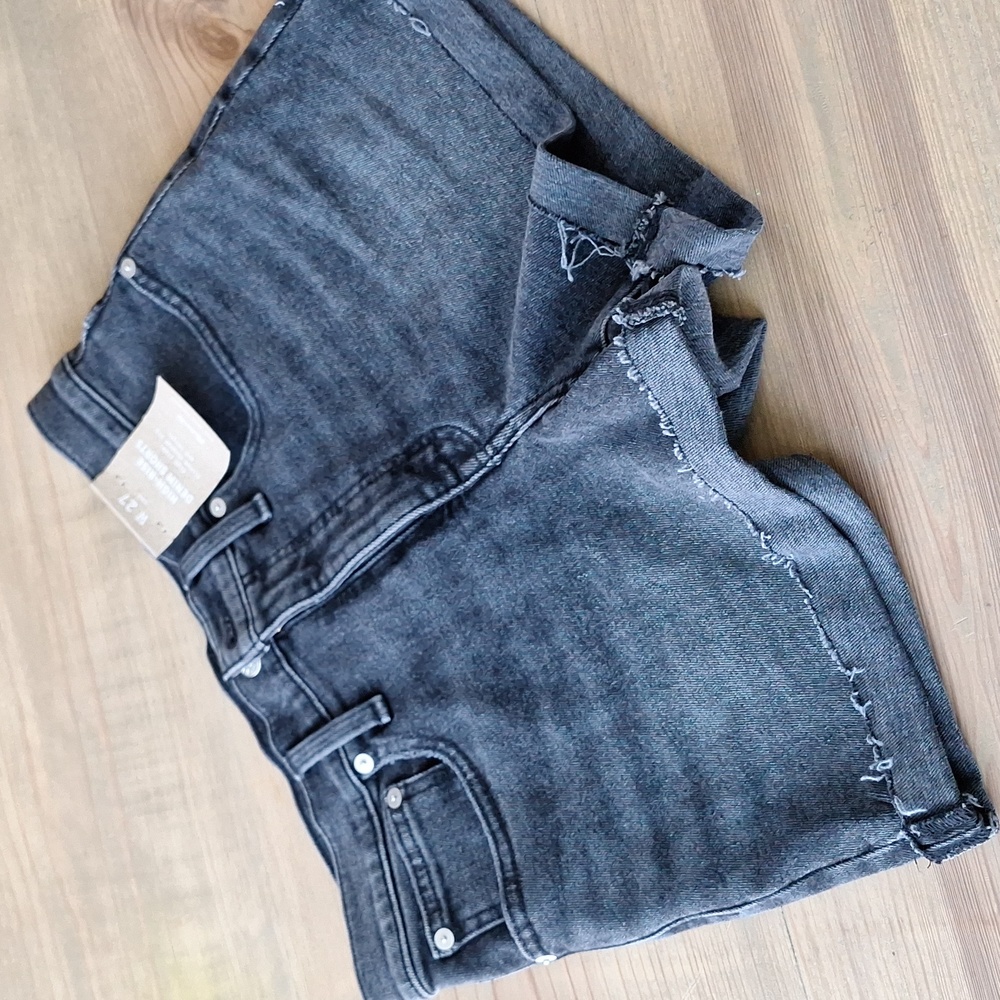 Black high rise denim short.